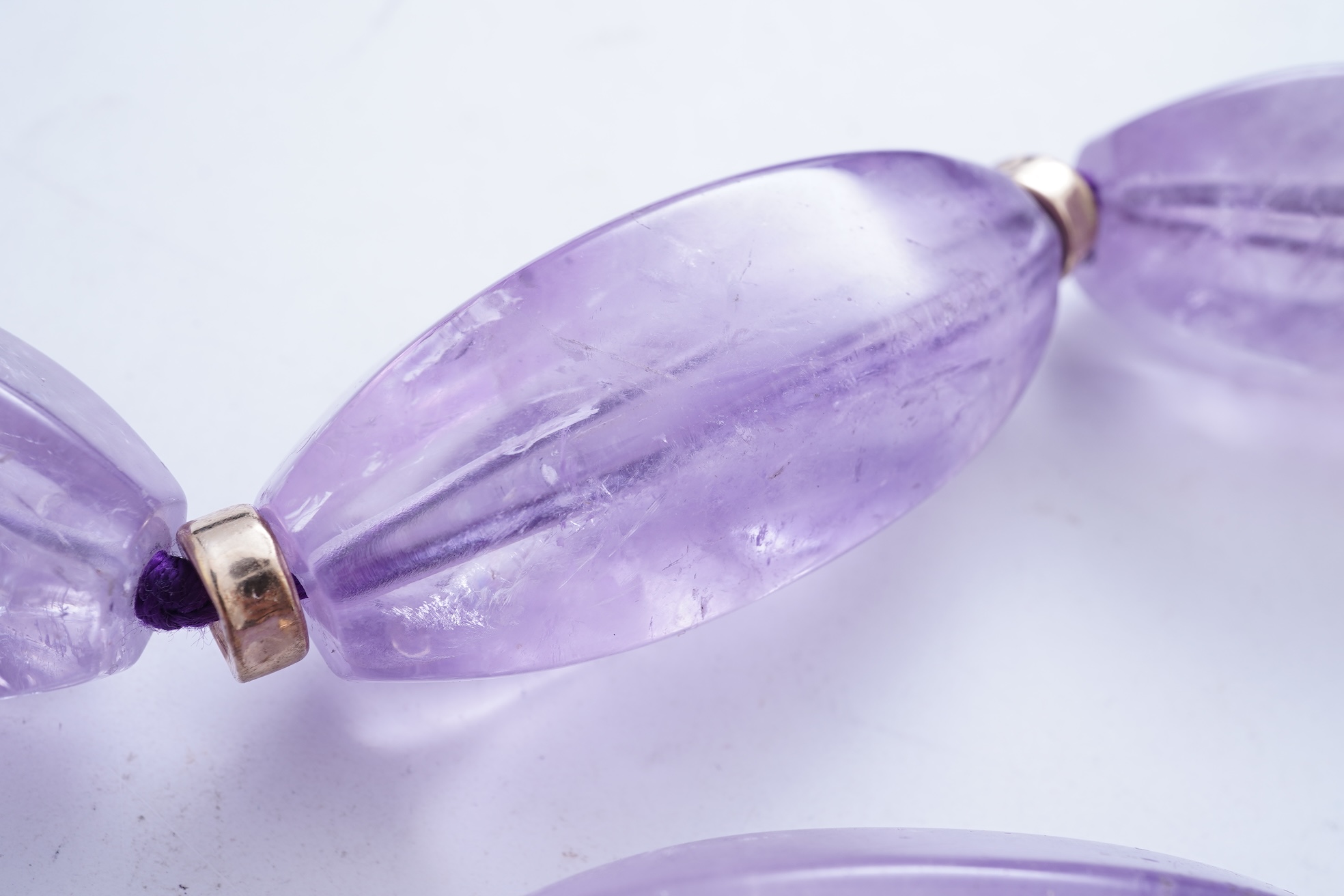 An amethyst and gold necklace